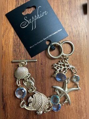 Cracker Barrel Gold Tone Bracelet Blue Bezel Fish Shell Sapphire